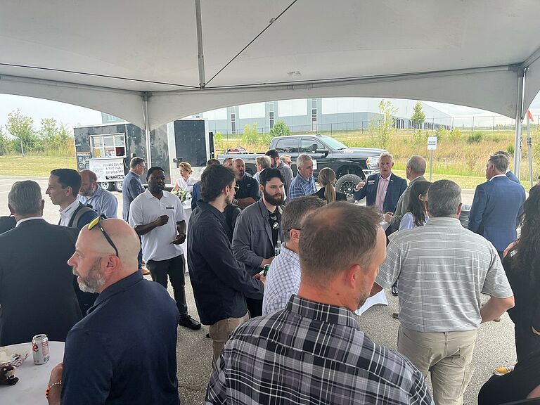photo, visitors at the grand opening reception
